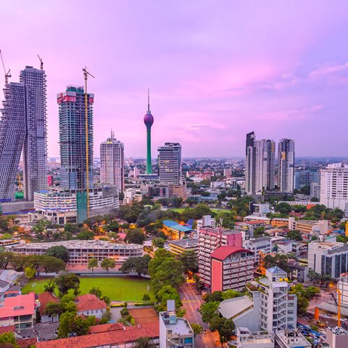 Colombo Sri Lanka skyline cityscape photo. Sunset in Colombo with views over the biggest city in Sri Lanka island. Urban views of buildings and the Laccadive Sea